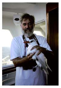 Dr Cameron Kepler Holds A Red-tailed Tropicbird